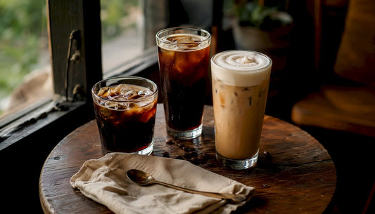 Assortment of iced coffee drinks on wooden table