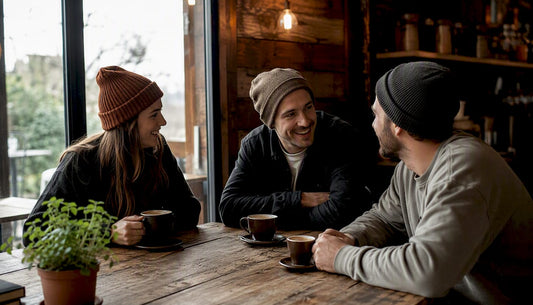 Three different beanie styles worn outdoors on heads