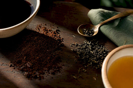 Coffee and tea comparison in warm light