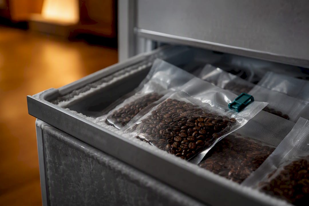 Vacuum sealed coffee portions in freezer drawer