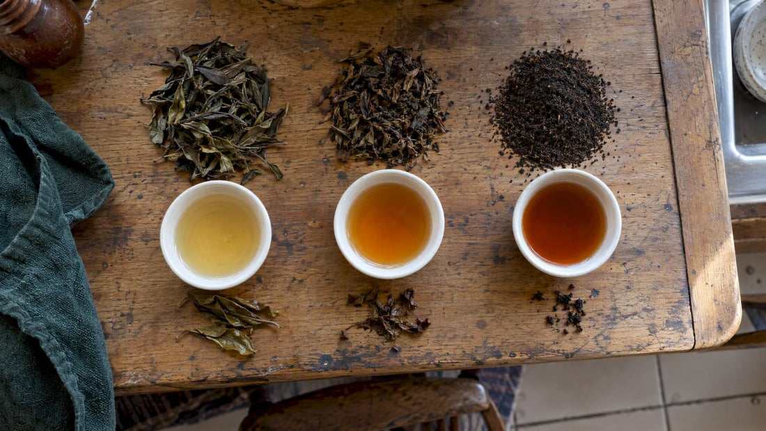 Tea grades and brewed samples on wood